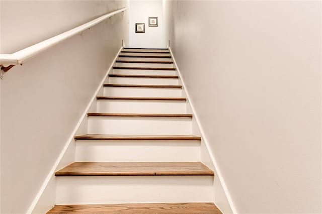 stairway featuring hardwood / wood-style flooring