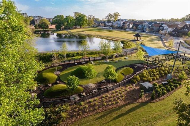 drone / aerial view with a residential view and a water view