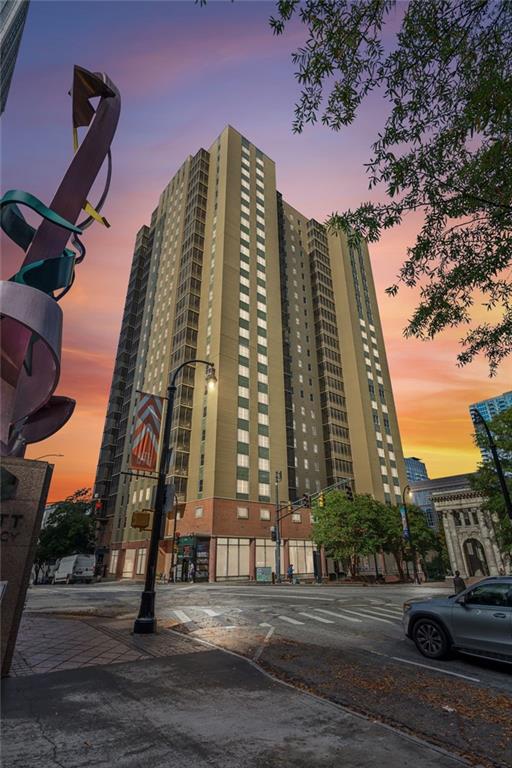 300 Peachtree St NE Unit 6C, Atlanta, GA 30308 - view of outdoor building at dusk