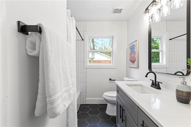 full bath with tile patterned floors, visible vents, toilet, shower / bath combo, and vanity