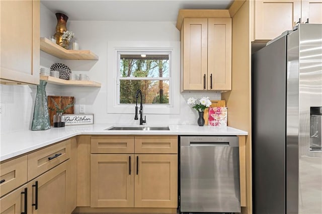 kitchen with open shelves, a sink, stainless steel appliances, light countertops, and tasteful backsplash