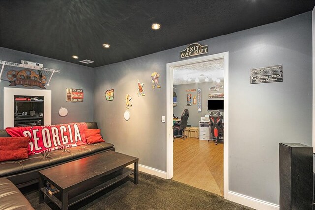 6355 Queens Rd, Douglasville, GA 30135 - living room featuring visible vents, baseboards, and carpet flooring