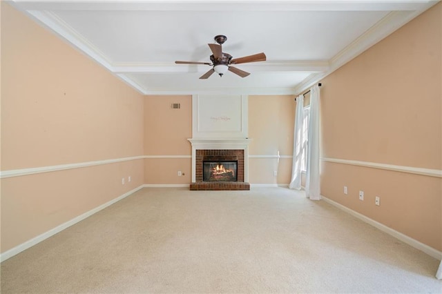 unfurnished living room with ornamental molding, carpet floors, a ceiling fan, a fireplace, and baseboards
