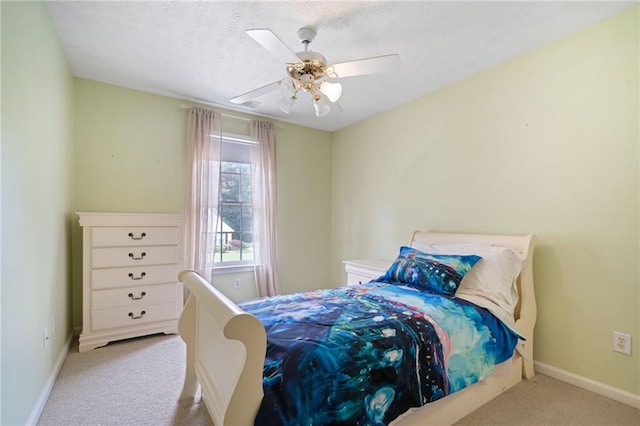 bedroom featuring carpet, baseboards, and a ceiling fan