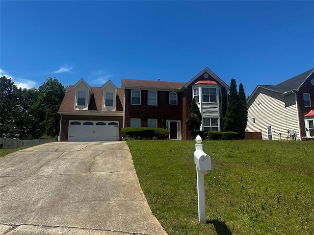 view of front of home with concrete driveway and a garage