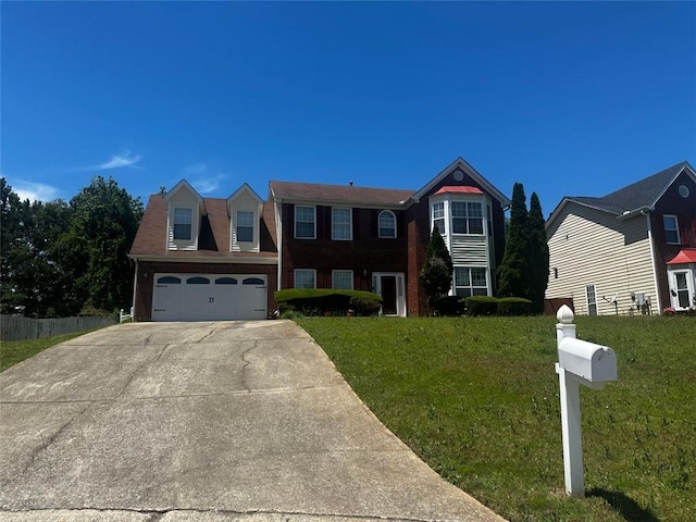 view of front of property featuring concrete driveway, a garage, and a front lawn