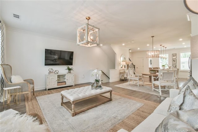 living area featuring an inviting chandelier, visible vents, and recessed lighting