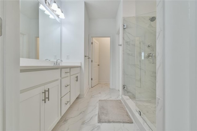 full bathroom featuring a marble finish shower, marble finish floor, and vanity