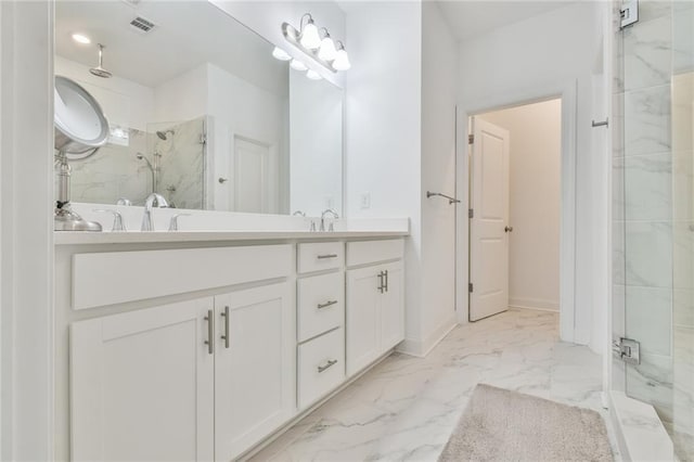 bathroom with marble finish floor, visible vents, a sink, double vanity, and a marble finish shower