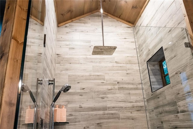 bathroom with wooden walls and tiled shower