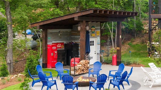 view of patio / terrace with a fire pit