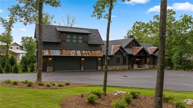 view of front facade featuring a garage and a front lawn