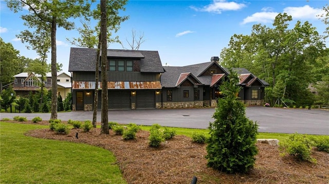 view of front of house with a front yard and a garage