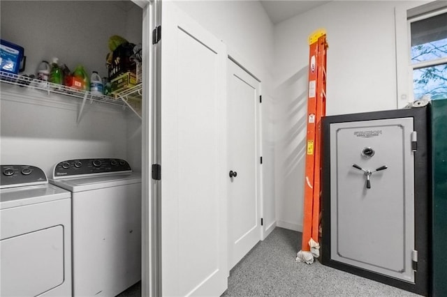 clothes washing area featuring separate washer and dryer