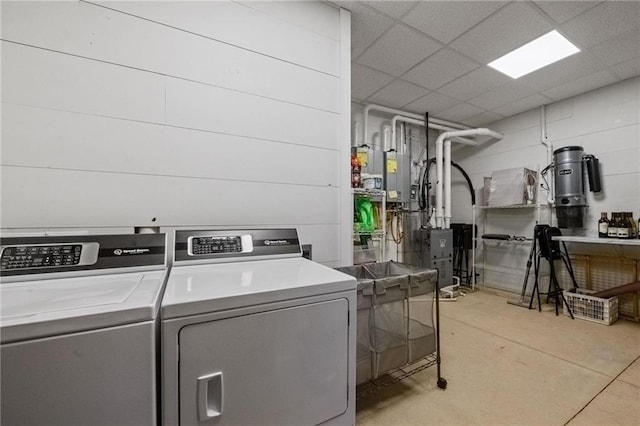 clothes washing area featuring washing machine and clothes dryer