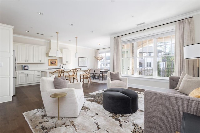 living room featuring ornamental molding and dark hardwood / wood-style flooring