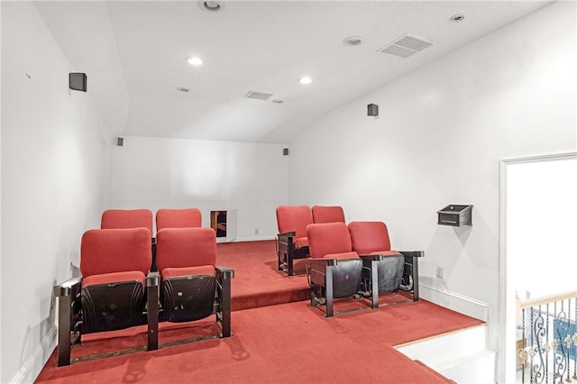 cinema room with visible vents, baseboards, lofted ceiling, carpet, and recessed lighting