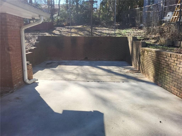 view of patio / terrace featuring fence