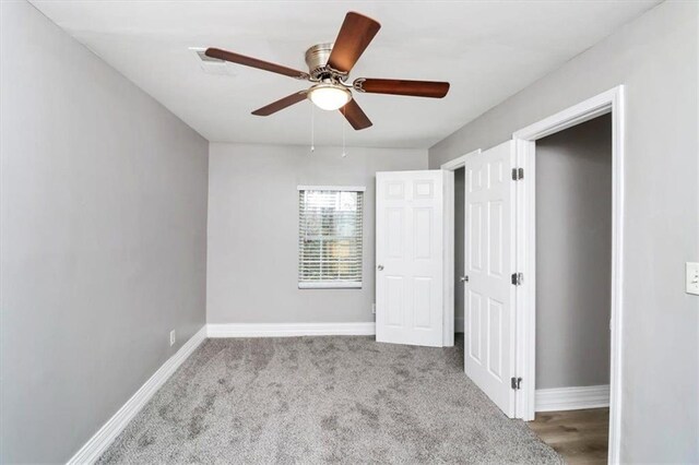 2222 Mcafee Rd, Decatur, GA 30032 - unfurnished bedroom with light colored carpet and ceiling fan