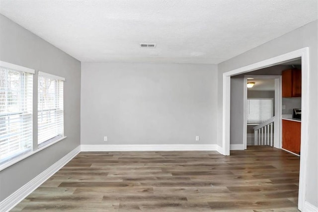 2222 Mcafee Rd, Decatur, GA 30032 - spare room with dark wood-type flooring and a textured ceiling