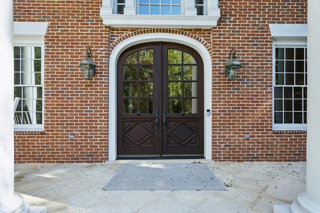 view of exterior entry featuring french doors