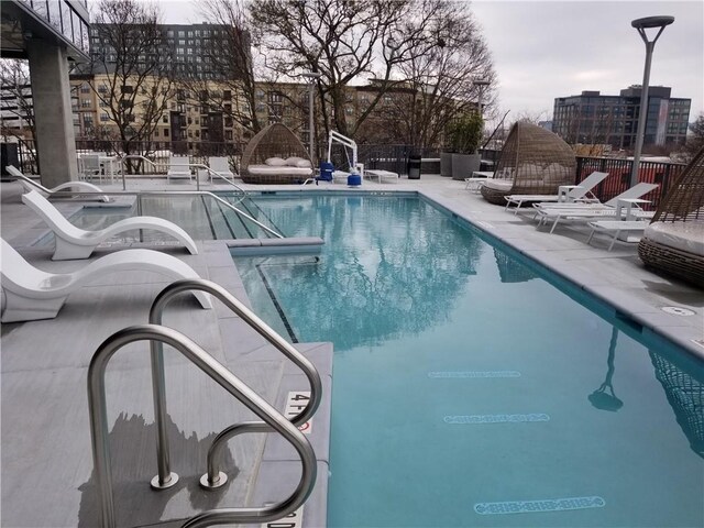 view of pool featuring a patio area