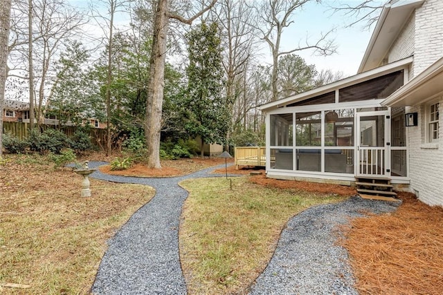 view of yard with a sunroom