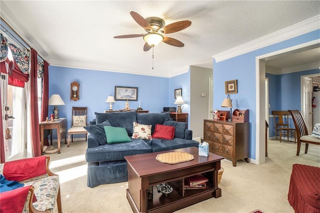 living room with ceiling fan, light colored carpet, and ornamental molding