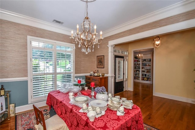 1173 Saint Charles Pl, Gainesville, GA 30501 - dining area with a chandelier, wood finished floors, wallpapered walls, and ornamental molding