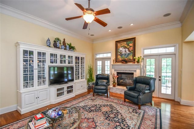 1173 Saint Charles Pl, Gainesville, GA 30501 - living room with french doors, a glass covered fireplace, wood finished floors, crown molding, and ceiling fan