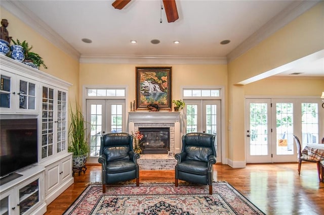 1173 Saint Charles Pl, Gainesville, GA 30501 - living room featuring french doors, a brick fireplace, wood finished floors, and ornamental molding