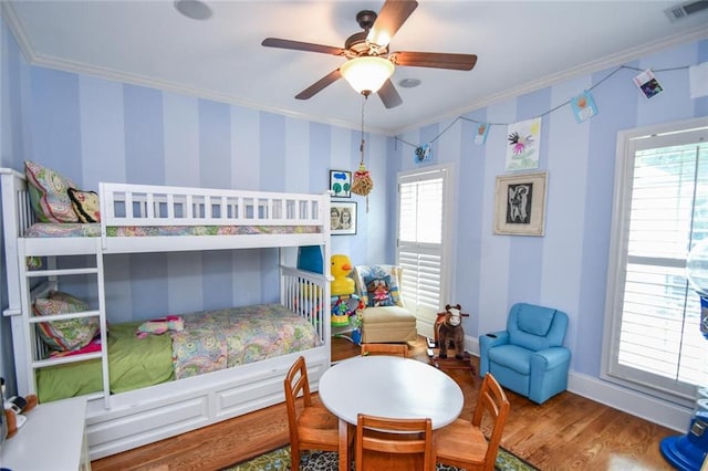 1173 Saint Charles Pl, Gainesville, GA 30501 - bedroom featuring crown molding, wood finished floors, wallpapered walls, and ceiling fan