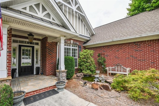 1173 Saint Charles Pl, Gainesville, GA 30501 - entrance to property featuring brick siding, roof with shingles, and covered porch