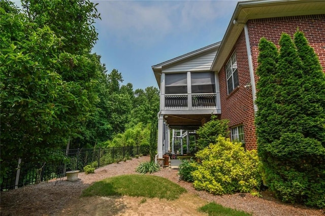 1173 Saint Charles Pl, Gainesville, GA 30501 - view of home's exterior featuring brick siding and a sunroom