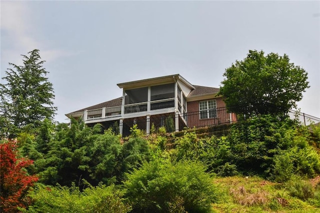 1173 Saint Charles Pl, Gainesville, GA 30501 - rear view of property featuring a sunroom and brick siding