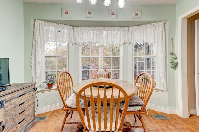 dining area featuring hardwood / wood-style floors