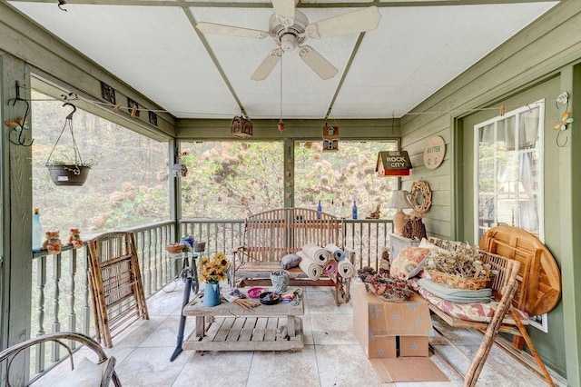 sunroom featuring ceiling fan