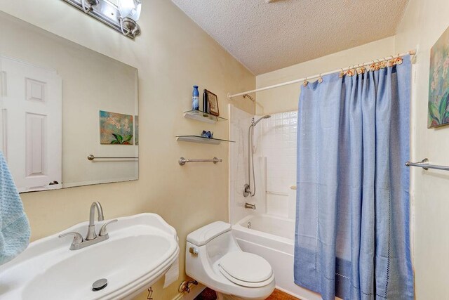 carpeted bedroom featuring multiple windows, ceiling fan, and a textured ceiling