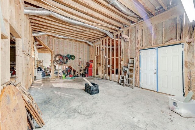 laundry area featuring washer and clothes dryer, cabinets, plenty of natural light, and sink