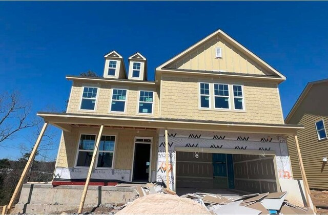 view of front of property featuring a garage and a front yard