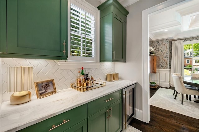 bar featuring ornamental molding, dark wood-style floors, wine cooler, wainscoting, and tasteful backsplash
