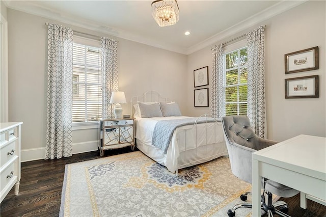 bedroom featuring wood finished floors, crown molding, baseboards, recessed lighting, and a desk