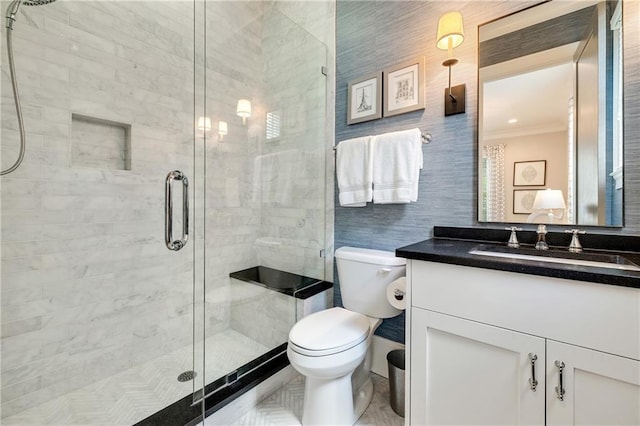 full bath with crown molding, vanity, toilet, and a stall shower