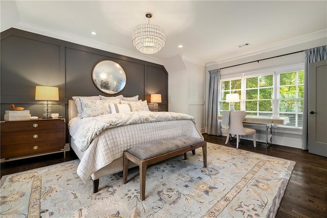 bedroom with crown molding, wood finished floors, a chandelier, and recessed lighting