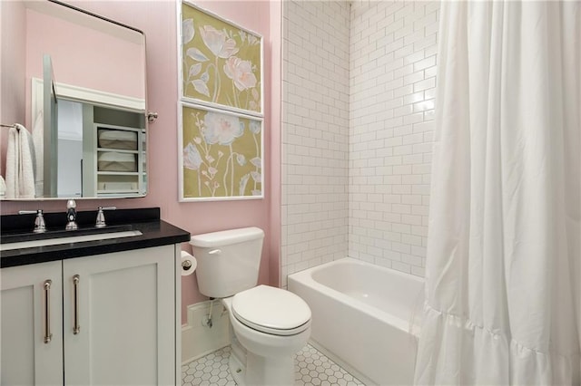 full bath with toilet, vanity, tile patterned floors, shower / bath combo, and baseboards