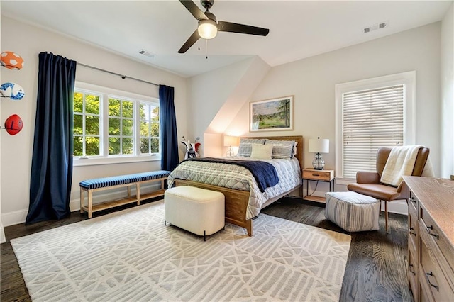bedroom featuring wood finished floors, baseboards, and ceiling fan