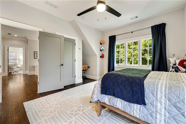 bedroom with dark wood-style flooring, baseboards, and a ceiling fan