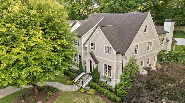 view from above of property featuring a tree filled landscape