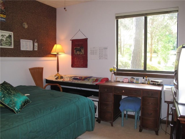 bedroom featuring light carpet