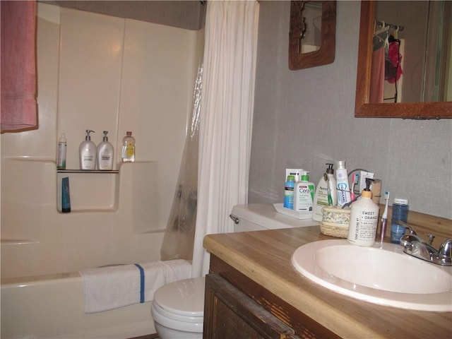 full bath with toilet, shower / bathtub combination with curtain, and vanity